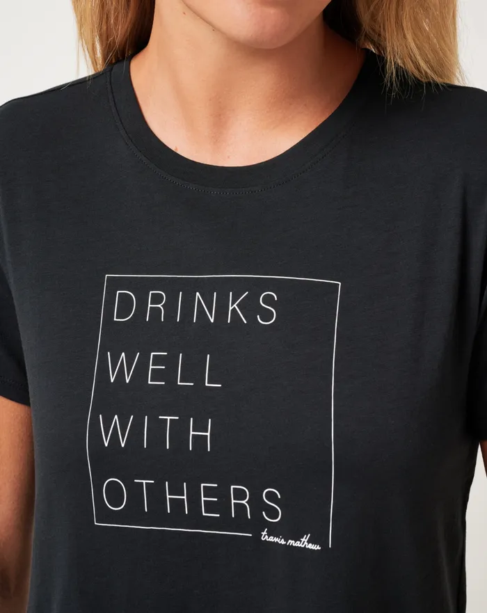 Women Tees TravisMathew DAY AT THE RACES GRAPHIC TEE Black